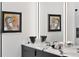 Modern double vanity with white quartz countertop and black cabinets at 50 Central Ave # 16S, Sarasota, FL 34236