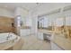 Large bathroom with soaking tub, double vanity and shower at 5331 Siesta Cove Dr, Sarasota, FL 34242