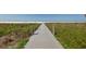 Wooden boardwalk leading to Siesta Beach at 5331 Siesta Cove Dr, Sarasota, FL 34242
