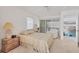 Bedroom with a queen bed, and access to the lanai at 5331 Siesta Cove Dr, Sarasota, FL 34242