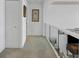Second floor hallway with carpet and built-in closet at 5331 Siesta Cove Dr, Sarasota, FL 34242