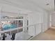 Second-floor hallway overlooking the pool and lanai at 5331 Siesta Cove Dr, Sarasota, FL 34242