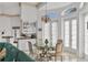 Kitchen features breakfast nook, glass-top table, and white cabinets at 5331 Siesta Cove Dr, Sarasota, FL 34242