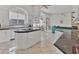 Spacious kitchen with granite countertops, white cabinets, and an island; open to Gathering room at 5331 Siesta Cove Dr, Sarasota, FL 34242