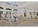 Elegant living room with high ceilings, access to the pool, and ample natural light at 5331 Siesta Cove Dr, Sarasota, FL 34242