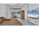 Main bedroom with large TV, pool view, and walk-in closet at 5331 Siesta Cove Dr, Sarasota, FL 34242