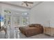 Spacious main bedroom with large windows and brown bedding at 5331 Siesta Cove Dr, Sarasota, FL 34242