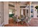 Outdoor patio dining area with glass-top table at 5331 Siesta Cove Dr, Sarasota, FL 34242