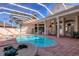 Screened pool and spa with ample patio space for seating at 5331 Siesta Cove Dr, Sarasota, FL 34242