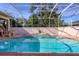 Relaxing pool and spa area with screened enclosure at 5331 Siesta Cove Dr, Sarasota, FL 34242