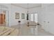 Bright sitting area with chaise lounge and French doors at 5331 Siesta Cove Dr, Sarasota, FL 34242