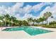 Community pool area with palm trees and plenty of space for relaxing at 5352 Fairfield Blvd, Bradenton, FL 34203