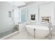 Spa-like bathroom with freestanding tub and glass shower at 540 N Tamiami Trl # 1201, Sarasota, FL 34236