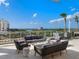 Outdoor patio with firepit and seating at 540 N Tamiami Trl # 1201, Sarasota, FL 34236