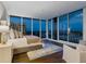 Main bedroom with city view and floor-to-ceiling windows at 540 N Tamiami Trl # 1201, Sarasota, FL 34236