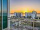 Stunning sunset view from balcony overlooking cityscape and ocean at 540 N Tamiami Trl # 1201, Sarasota, FL 34236