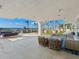 Spacious patio with lounge seating and water views at 540 N Tamiami Trl # 1201, Sarasota, FL 34236