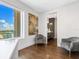 Relaxing sitting area with two armchairs and a view at 540 N Tamiami Trl # 1201, Sarasota, FL 34236