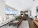 Open living room with access to balcony and kitchen at 540 N Tamiami Trl # 1201, Sarasota, FL 34236