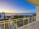 Evening view from a large balcony overlooking the water at 540 N Tamiami Trl # 1201, Sarasota, FL 34236