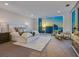 Luxurious bedroom with stunning sunset view and seating area at 540 N Tamiami Trl # 1201, Sarasota, FL 34236