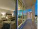 Bedroom with large windows offering city views and access to balcony at 540 N Tamiami Trl # 1201, Sarasota, FL 34236
