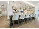 Modern bar with marble countertop and gold pendant lights at 540 N Tamiami Trl # 1201, Sarasota, FL 34236