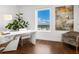 Bright home office with city views and modern white desk at 540 N Tamiami Trl # 1201, Sarasota, FL 34236