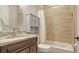 Bathroom with a tub, granite countertop, and updated vanity at 6722 Hawkins Rd, Sarasota, FL 34241