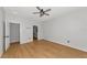 Bedroom with wood-look floors and an adjacent bathroom at 7746 108Th Avenue E Cir, Parrish, FL 34219