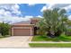Two-story home with attached garage and palm tree at 7746 108Th Avenue E Cir, Parrish, FL 34219