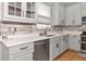Modern kitchen with stainless steel appliances and white cabinets at 7746 108Th Avenue E Cir, Parrish, FL 34219