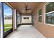 Spacious screened patio with ceiling fan, perfect for relaxing outdoors at 7746 108Th Avenue E Cir, Parrish, FL 34219