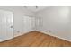 Spacious bedroom with wood-look floors and double door closet at 7746 108Th Avenue E Cir, Parrish, FL 34219