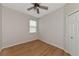Spacious bedroom with wood-look flooring and ceiling fan at 7746 108Th Avenue E Cir, Parrish, FL 34219