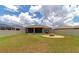 Spacious backyard featuring a fire pit and patio at 7746 108Th Avenue E Cir, Parrish, FL 34219
