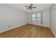 Bright bedroom with wood-look flooring and ceiling fan at 7746 108Th Avenue E Cir, Parrish, FL 34219