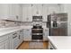 Modern kitchen with stainless steel appliances and white cabinets at 7746 108Th Avenue E Cir, Parrish, FL 34219
