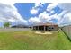 Large backyard with fire pit and covered patio at 7746 108Th Avenue E Cir, Parrish, FL 34219