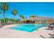 Resort-style community pool with lounge chairs and umbrellas at 7746 108Th Avenue E Cir, Parrish, FL 34219