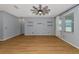 Living room with wood-look floors and ceiling fan at 7746 108Th Avenue E Cir, Parrish, FL 34219