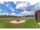 Landscaped backyard with fire pit and seating area at 7746 108Th Avenue E Cir, Parrish, FL 34219
