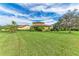 Expansive grassy backyard showcasing the home's rear elevation at 10655 Glencorse Ter, Bradenton, FL 34211