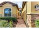 Brick walkway entrance to the home with lush landscaping at 10655 Glencorse Ter, Bradenton, FL 34211