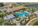 Community features pools, clubhouse and lush landscaping at 12413 Parigi Way, Sarasota, FL 34238