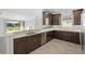 Modern kitchen with stainless steel appliances and ample cabinetry at 12413 Parigi Way, Sarasota, FL 34238