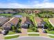 Aerial view of houses near a lake at 12413 Parigi Way, Sarasota, FL 34238