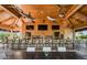 Relax at the community clubhouse, featuring a bar, TVs, and comfortable seating at 12413 Parigi Way, Sarasota, FL 34238