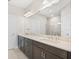 Modern bathroom with double vanity and walk-in shower at 12413 Parigi Way, Sarasota, FL 34238