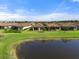 Aerial view of houses and lake at 12413 Parigi Way, Sarasota, FL 34238